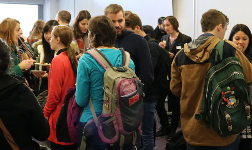 people chatting at event